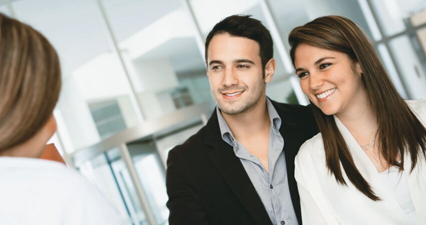 Couple Smiling with their Dentist